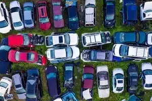 Cars stored in yard before collection by car scrapping service